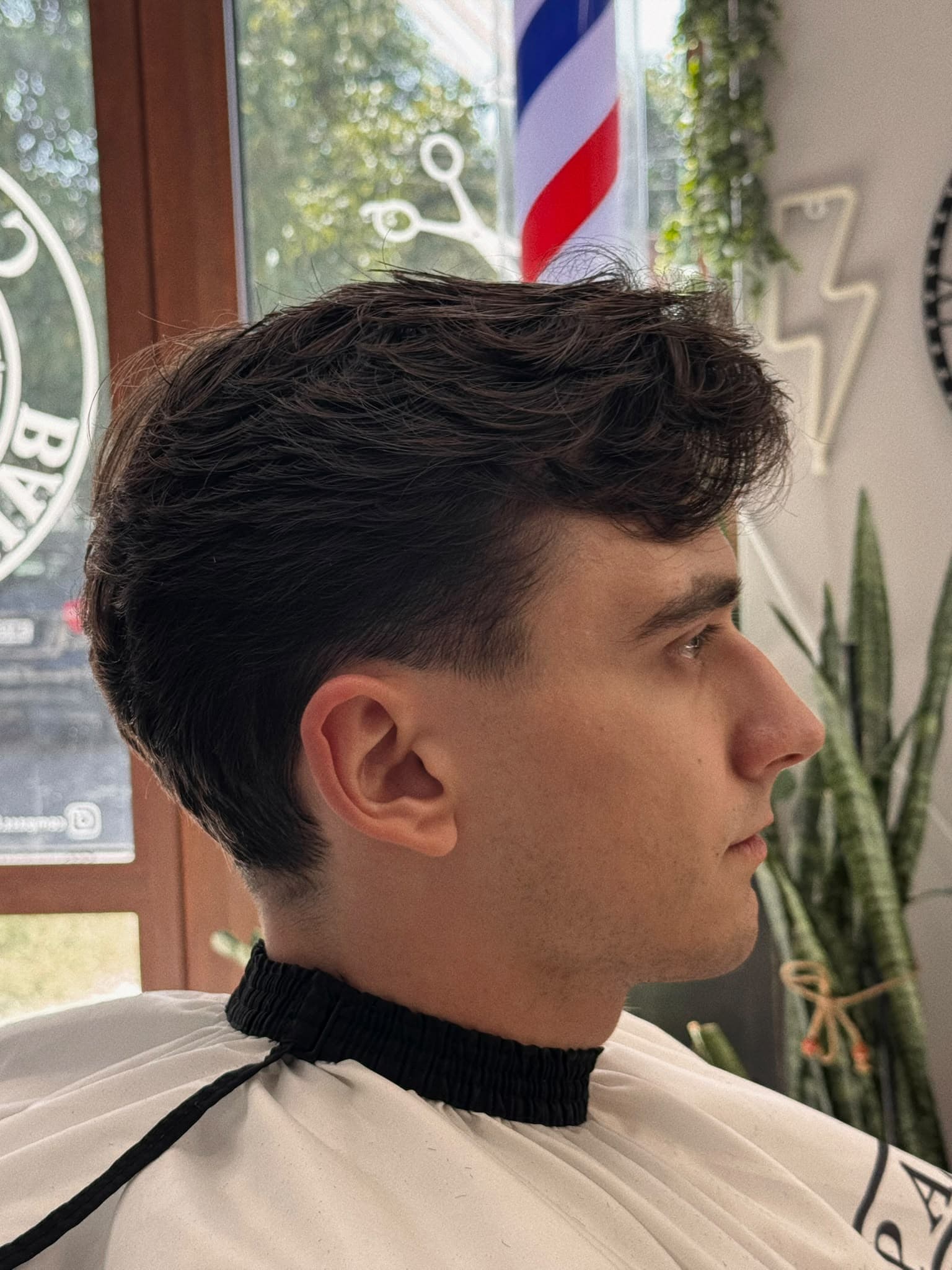 Men's wavy hair haircut with a taper fade, Haskovo